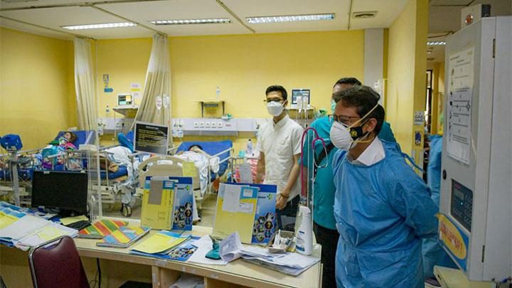 Empty pharmaceutical shelves in an Indonesian hospital pharmacy, representing the Covid antiviral drug shortage and its global supply chain implications