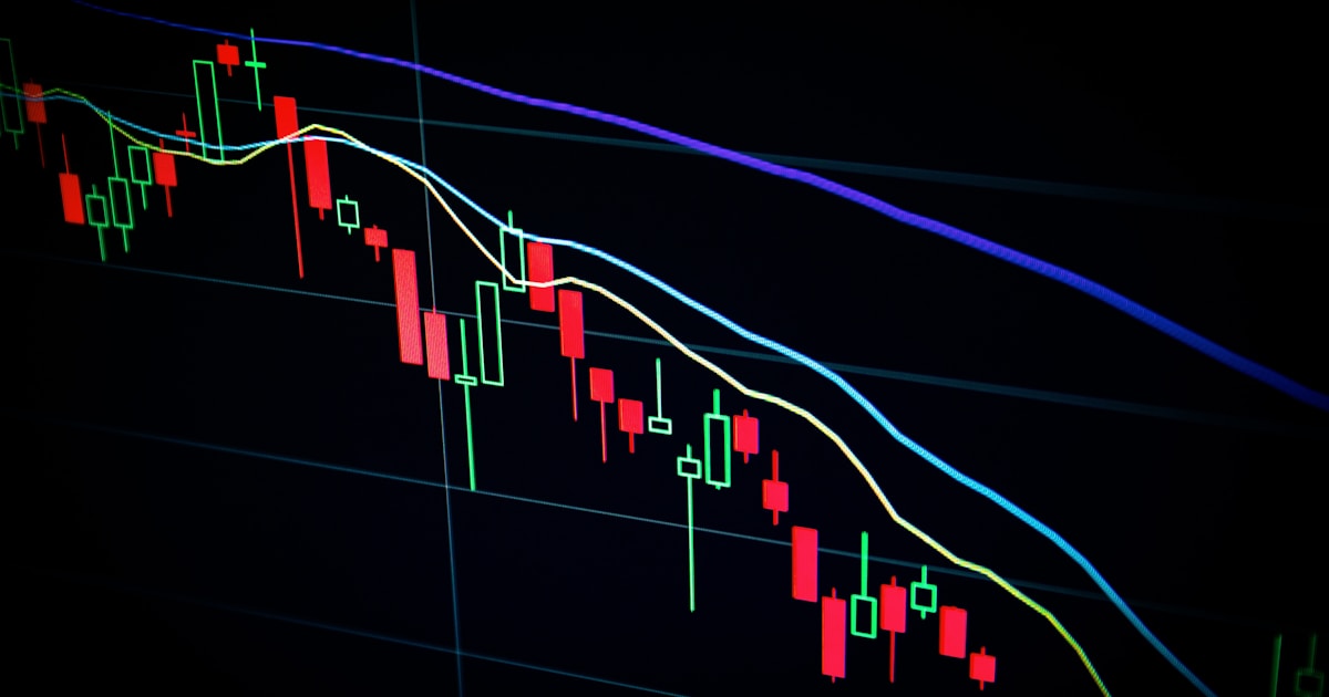 Options trader analyzing SPX volatility chart with multiple put and call positions on screen
